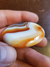 Load image into Gallery viewer, Carnelian is a stabilizing stone that restores vitality and motivation, and stimulates creativity. It gives courage, promotes positive life choices, dispels apathy and motivates for success. Carnelian is useful for overcoming abuse of any kind. It helps in trusting yourself and your perceptions.