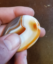 Load image into Gallery viewer, Carnelian is a stabilizing stone that restores vitality and motivation, and stimulates creativity. It gives courage, promotes positive life choices, dispels apathy and motivates for success. Carnelian is useful for overcoming abuse of any kind. It helps in trusting yourself and your perceptions.