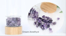 Load image into Gallery viewer, B.L.O.W. Co. Glass Water Bottle with Bamboo Lid & Crystals. 10 different stones from Amethyst, Aventurine, Tigers Eye, Rose Quartz, Clear Quartz, Citrine, Tourmaline, Red Jasper and MORE!! This also comes with a neoprene sleeve to keep your drinks cooler longer. This is available individually or as a gift set!!