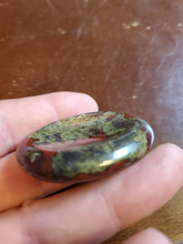 Load image into Gallery viewer, Dragon Bloodstone is mined in South Africa. Legend says the stone is the remains of deceased ancient dragons; the green being the skin and the red being the blood.
